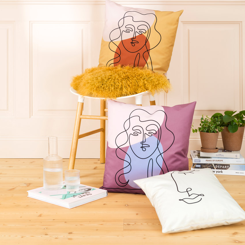 Magma Kissenserie „Modern Faces“ mit stilisierten Gesichtern in Linienzeichnung – moderne Kunstmotive in warmen Farbtönen wie Gelb, Rosa und Violett.