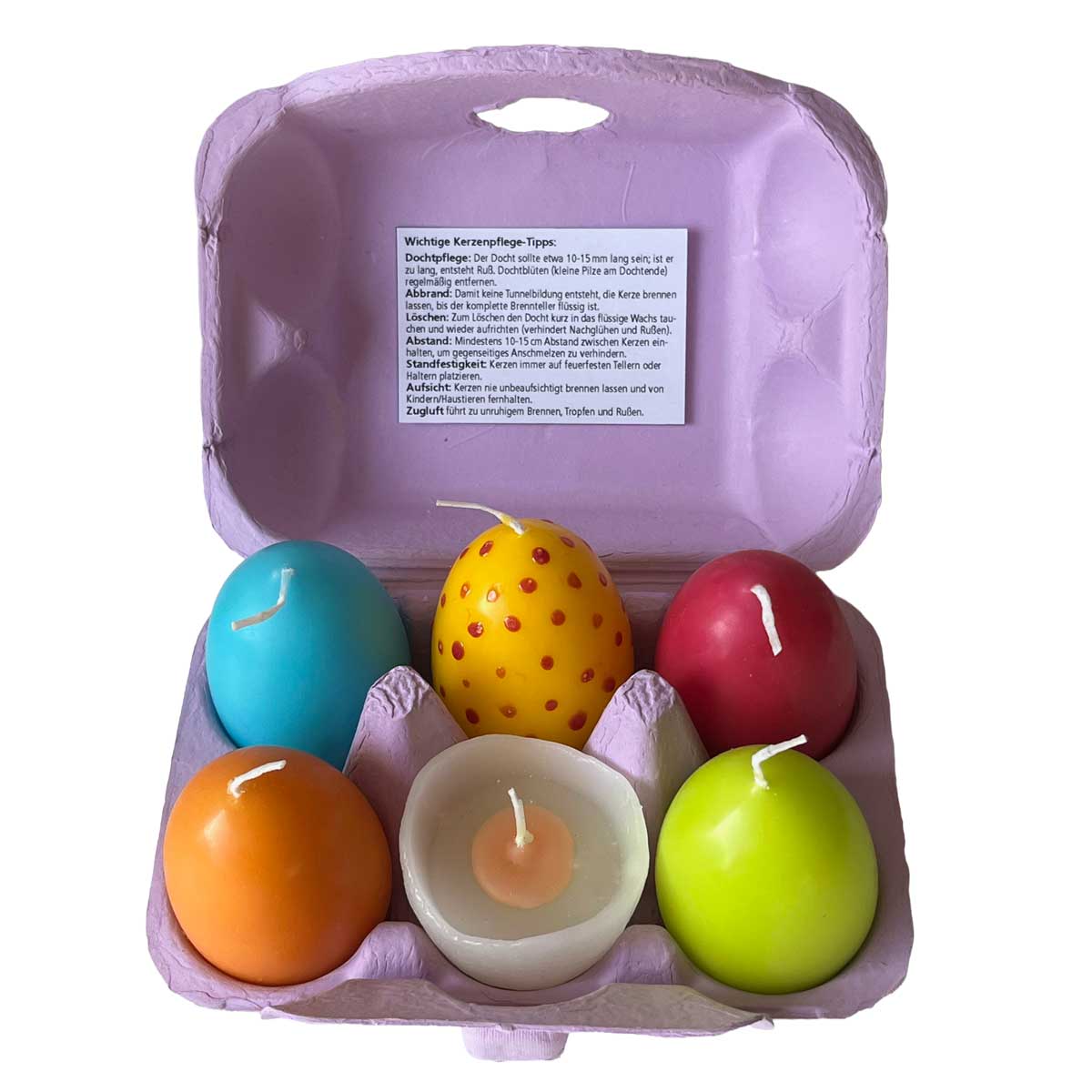 Bunte Ostereierkerzen im 6er Set im geöffneten Eierkarton – farbenfrohe Kerzen in Ei-Form als fröhliche Osterdeko und Geschenkidee für Frühling und Ostern.